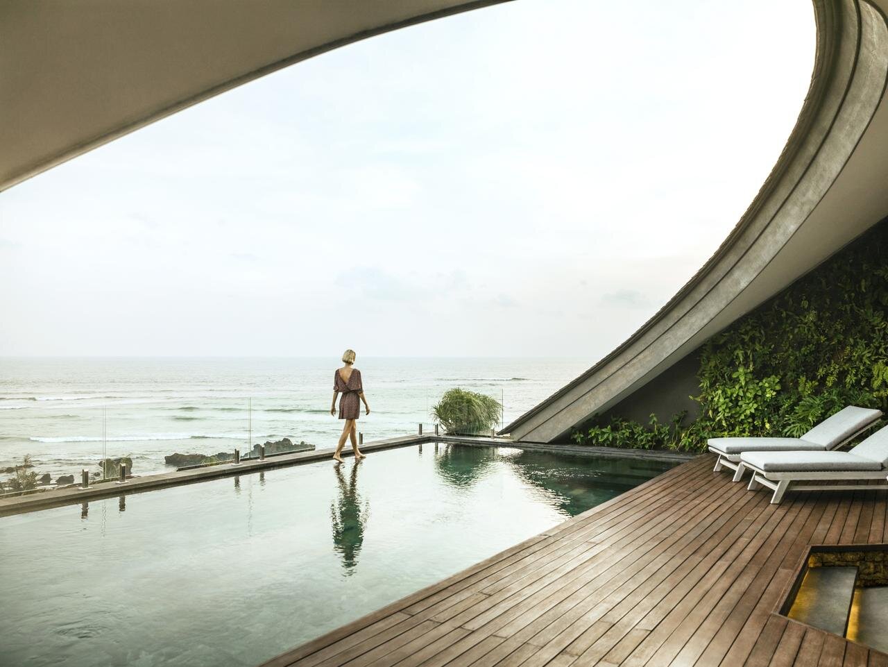 person walking near the pool at Como Uma Canggu Bali